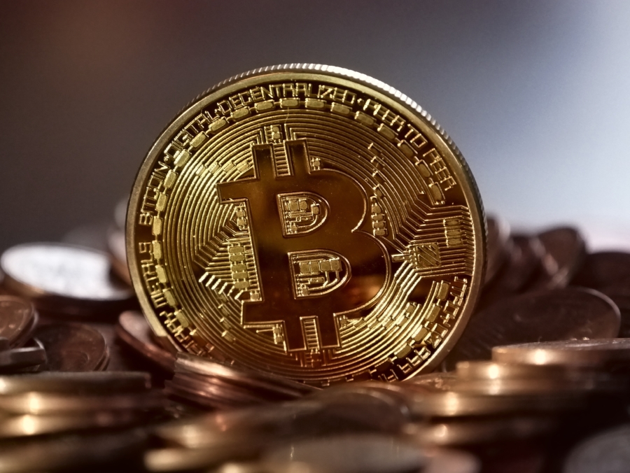 stack of coins with Bitcoin logo