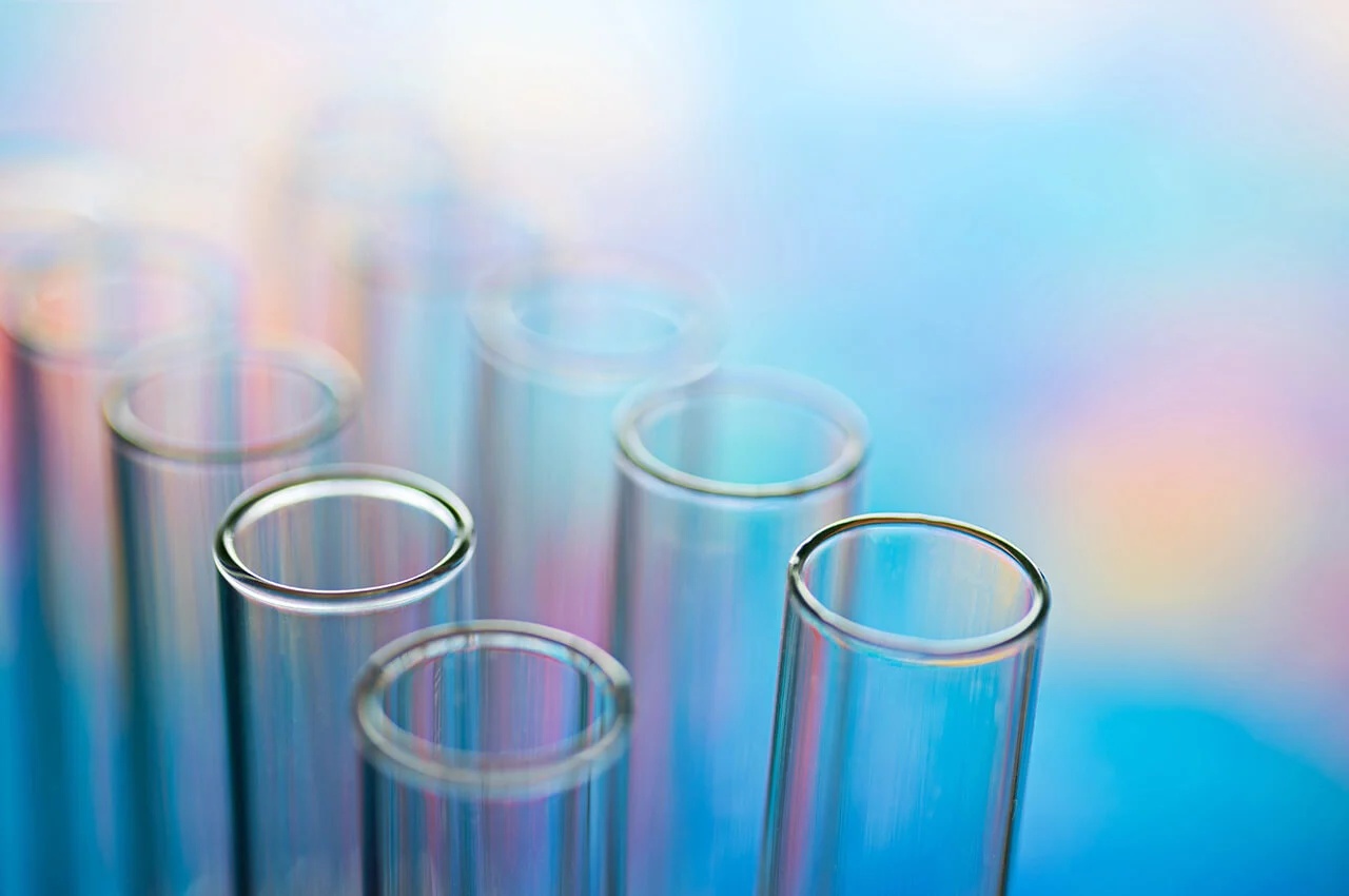 glass beakers on blue background